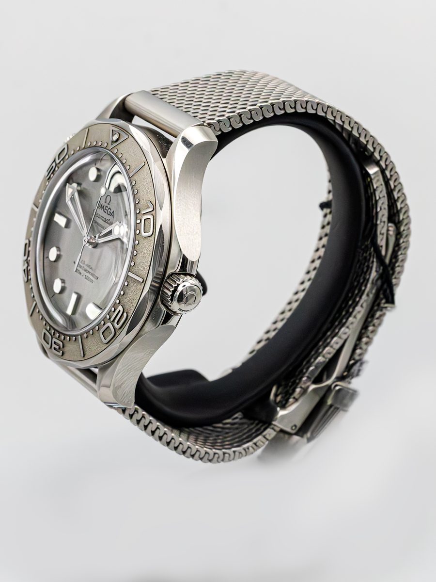 Omega Seamaster Diver 300M 007 Edition 210.92.42.20.01.001 grey tropical dial titanium mesh bracelet preowned luxury watch - angle view