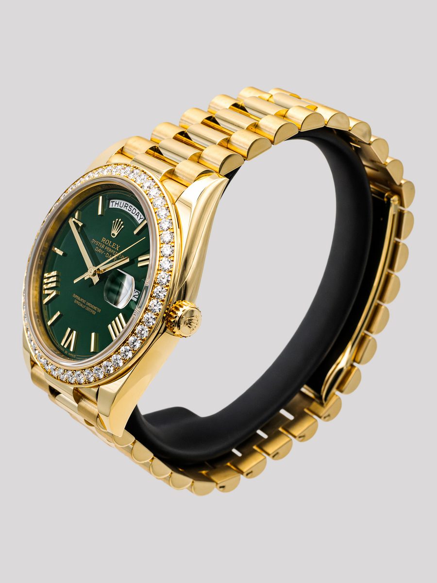 Rolex Day-Date 40 228348RBR green dial Roman numerals diamond-set bezel 18ct yellow gold President bracelet preowned luxury watch - angle view